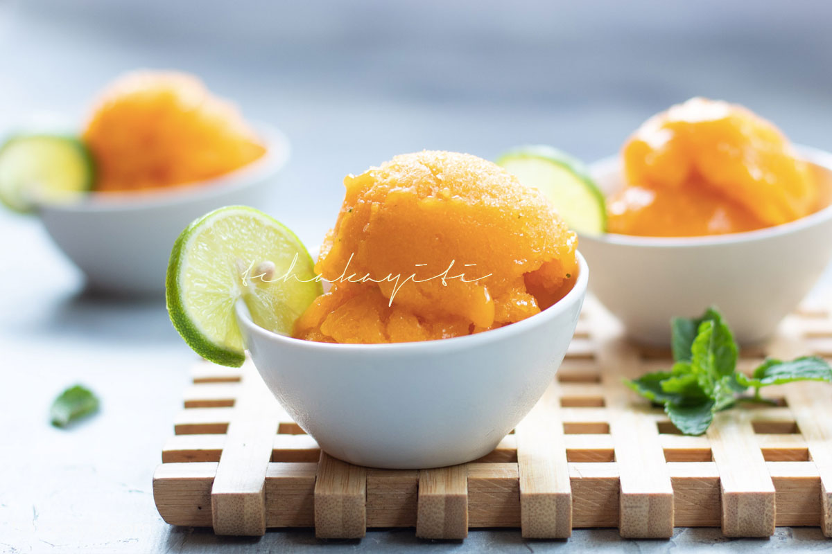 This mango sorbet is the perfect cold summer treat. And it's easy and simple to make. | tchakayiti.com