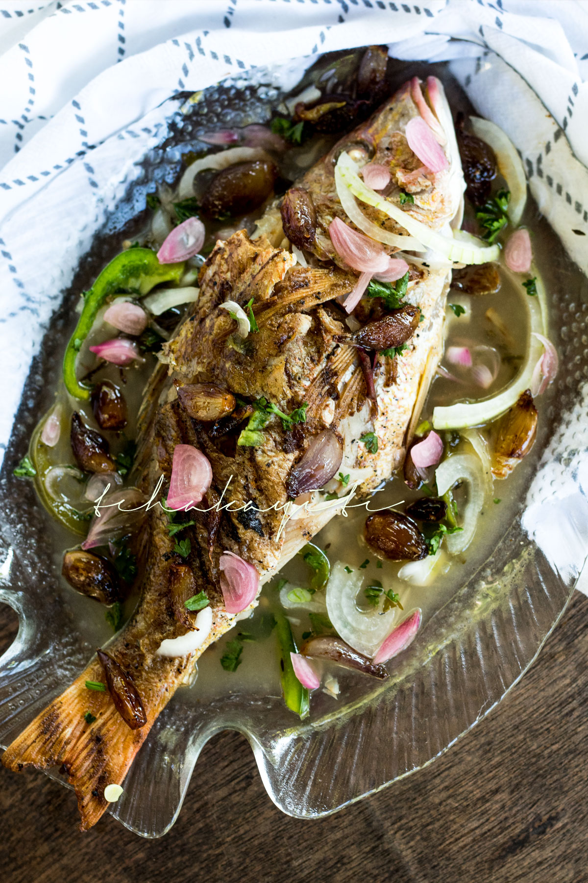 Poisson Gros Sel, a red snapper cooked in a court-bouillon with coarse salt, is a typical Haitian dish that is quite easy to make. Grab the recipe now. | tchakayiti.com
