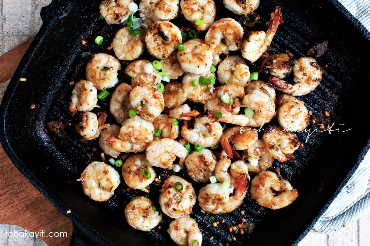 This spicy garlic grilled shrimp recipe includes a splash of rum. They'll keep you begging for more. | tchakayiti.com