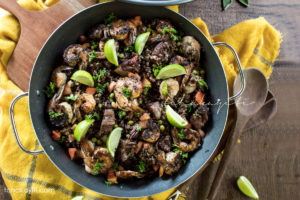 This Haitian style salt-cured pork and shrimp paella is packed with amazing flavors and enhanced with our famous local mushroom, djdondjon. A must try. | tchakayiti.com