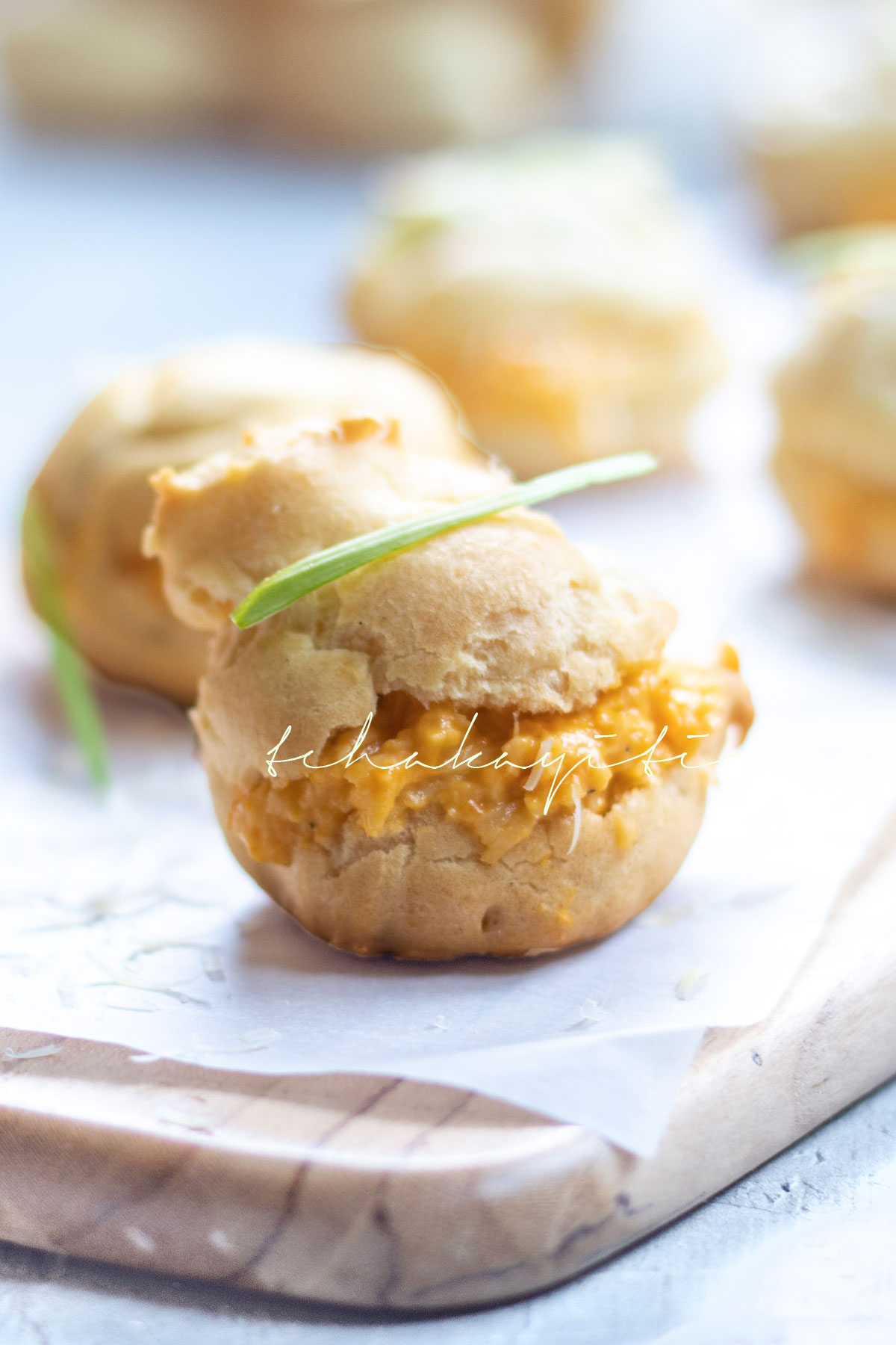 These pâte à choux, or bouchées as we call them, as filled with a spicy cheese spread enhanced with strong aromas of green pepper. They're a must on your appetizer menu.