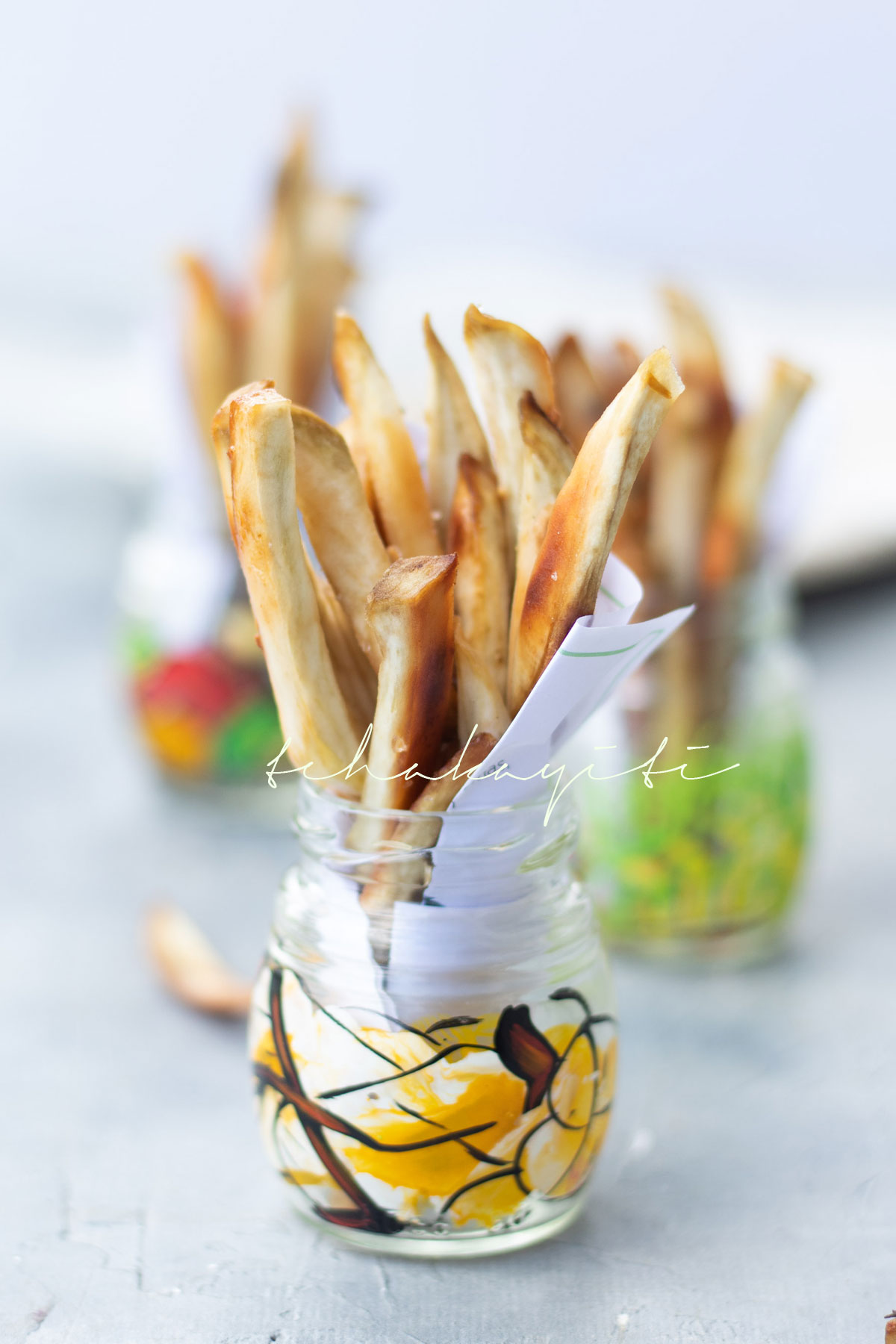 These oven baked Haitian fries are seasoned with salt, pepper and fresh garlic. | tchakayiti.com