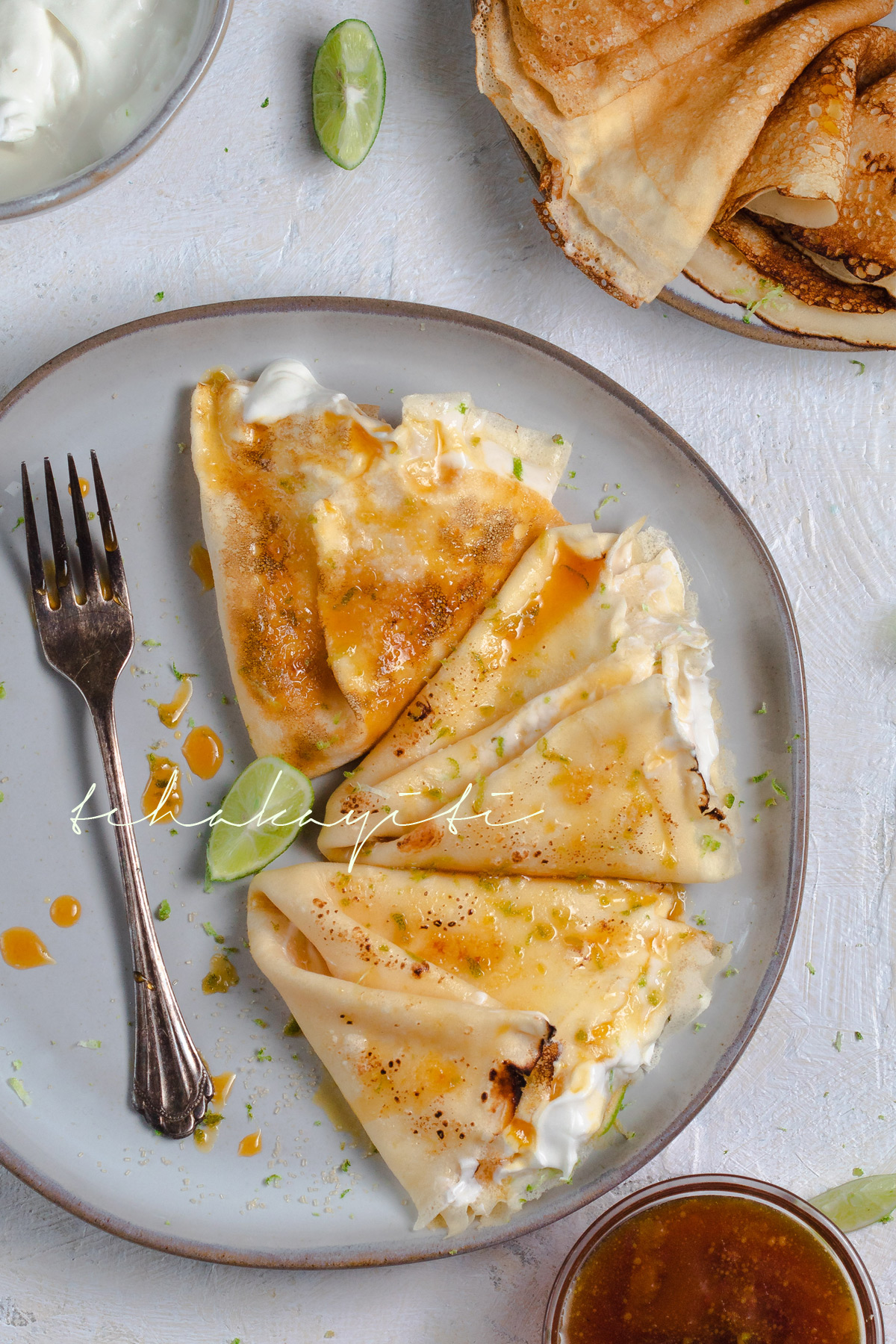 Sweet crêpes filled with a vanilla lime creme and drowned in a boozy caramel mandarine sauce | tchakayiti.com