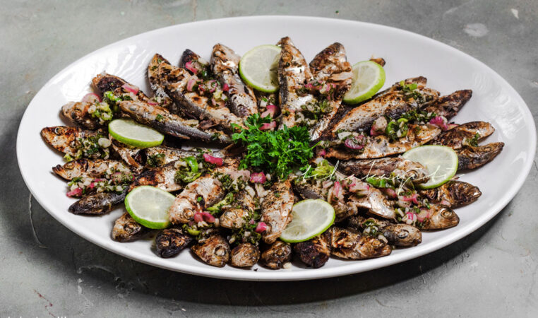 These charcoal grilled sardines with a zesty habanero hot sauce carry memories of Haitian food on a beach | Tchakayiti.com
